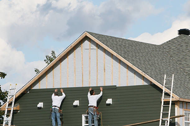 Professional Storm Damage Siding Repair technician working in Spruce Creek, PA